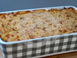 Close up of baked macaroni and cheese in a casserole dish