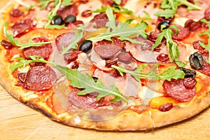 Close up baked pizza quattro carne.