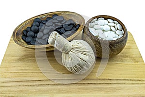 Close up ball compressing spa and black and white stone  present in Yin - Yang spa concept isolate on white background.Saved with