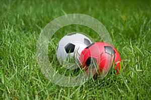 Close-up ball of football on green grass