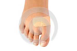 Close up of band-aid on a foot isolated. white