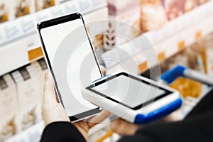 Close up of bar code scanner scanning mobile phone blank screen.