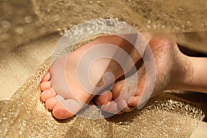 Close up bare foot in the morning at home, relaxing. Comfort aesthetics style. High contrast