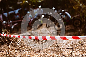 Close-up of barricade plastic rope with mountain bikes racing