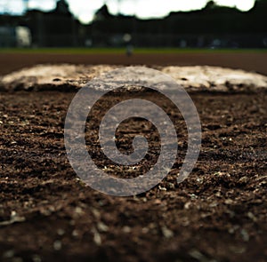Close up of baseball diamond pic with white base and lines