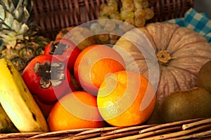 Close-up of a basket with autumn and winter fruit photo