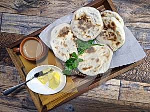 A close up of a basket of Baati roti for breakfast