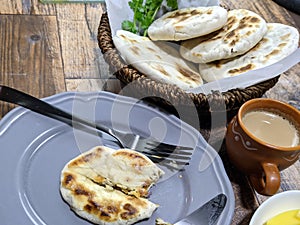 A close up of a basket of Baati roti for breakfast