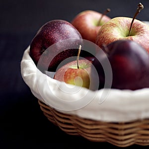 Close up of a basket of red apples. Conceptual image