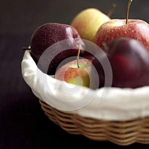 Close up of a basket of red apples. Conceptual image