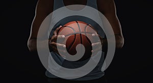 Close up of basketball ball in player hands