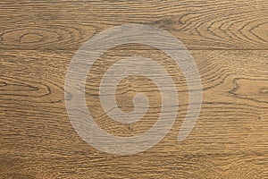 Close-up of bass-wood laminate floor covering of grey-brown color