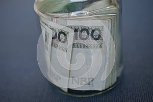 Close-up of a batch of polish banknotes Zloty in a jar