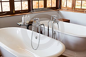 Close up of bathroom with two bathtubs