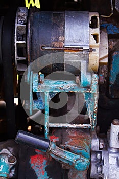 Close up of battered old farm tractor engine. Tractor machine