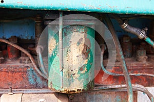 Close up of battered old farm tractor engine. Tractor machine