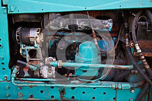 Close up of battered old farm tractor engine. Tractor machine