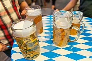 Close-up of bavarian beer glasses 1 liter Beer on table decoation at the Octoberfest