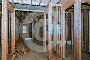 Close-up of beam built home under construction and blue sky with wooden truss, post and beam framework. d