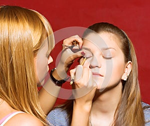 Close up of beautician creating makeup