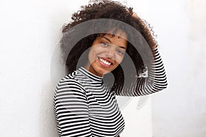 Close up beautiful african american woman with hand to curly hair