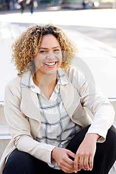 Close up beautiful african american woman smiling in city