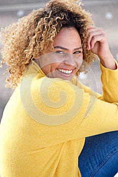 Close up beautiful african american woman smiling outdoors