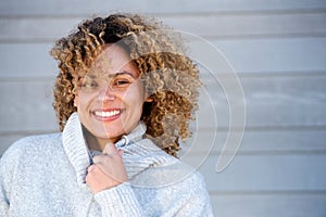 Close up beautiful african american woman smiling in warm sweater