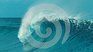 CLOSE UP: Beautiful emerald colored tube wave rushes towards the tropical coast.