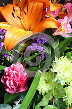 A close-up of beautiful flowers in different colors, lilies and other small flowers.