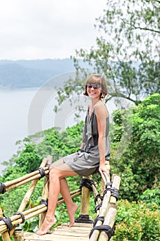 Close-up of beautiful girl posing in tropical forest of magic island Bali, Indonesia.