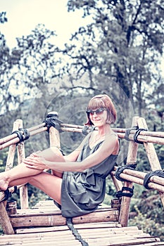 Close-up of beautiful girl posing in tropical forest of magic island Bali, Indonesia.