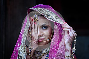 Close up Beautiful indian girl Young hindu woman model with kundan jewelry. photo