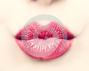 Close-up of beautiful kissing lips of woman.