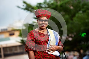 Close up of a beautiful mature african woman in traditional clothes, happy