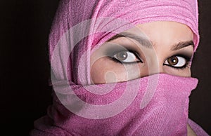 Close-up beautiful mysterious eyes eastern woman wearing a hijab