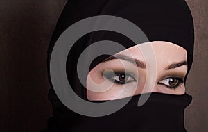 Close-up beautiful mysterious eyes eastern woman wearing a hijab