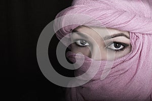 Close-up beautiful mysterious eyes eastern woman wearing a hijab