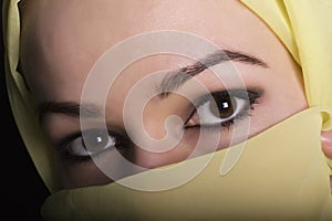 Close-up beautiful mysterious eyes eastern woman wearing a hijab