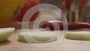 Close-up - Beautiful Onion Rings While Cooking In A Restaurant Kitchen. Scene. Slices of onion close-up