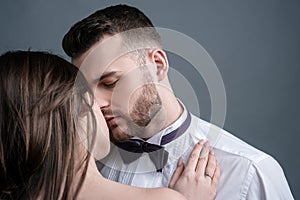 Close-up of beautiful passionate sexy couple kissing. Young girlfriend and boyfriend. photo