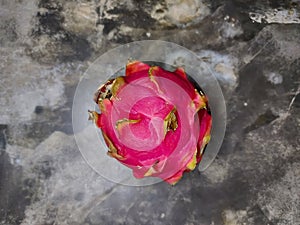 Close-up of beautiful red dragon fruit on blurred background.