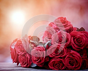 Close up beautiful red roses bouguet with glowing light background for valentine day and love theme