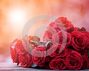 close up beautiful red roses bouguet with glowing light background for valentine day and love theme