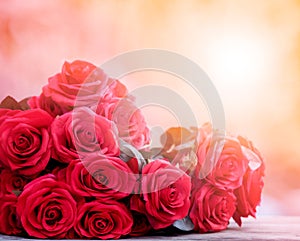 close up beautiful red roses bouguet with glowing light background for valentine day and love theme