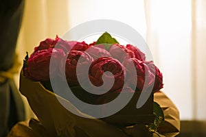 Close up beautiful red roses bouquet with glowing light background for valentine day and love theme.