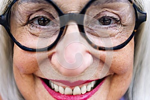 close-up of a beautiful senior woman smiling happy