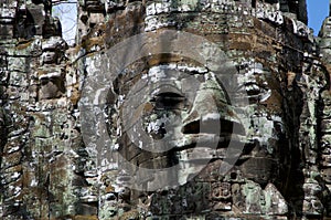 Smiling stone face at east gate of Bayon Temple in Cambodia