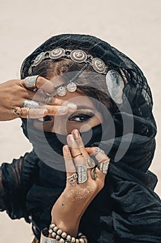 Close up of beautiful tribal woman. Hands of ethnic dancer. Soft