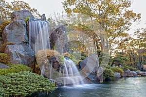 Close up beautiful waterfall and forest change color leaf  in autumn at japan